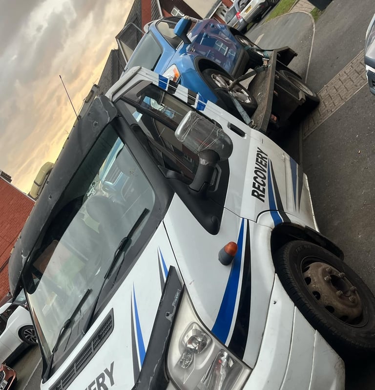 alt="Van loaded onto transport truck in Droitwich"