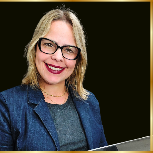 a woman with glasses and a blue jacket