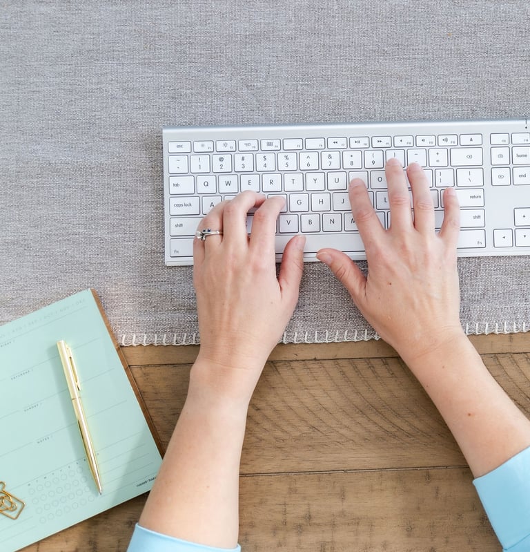 a virtual assistant typing on a keyboard