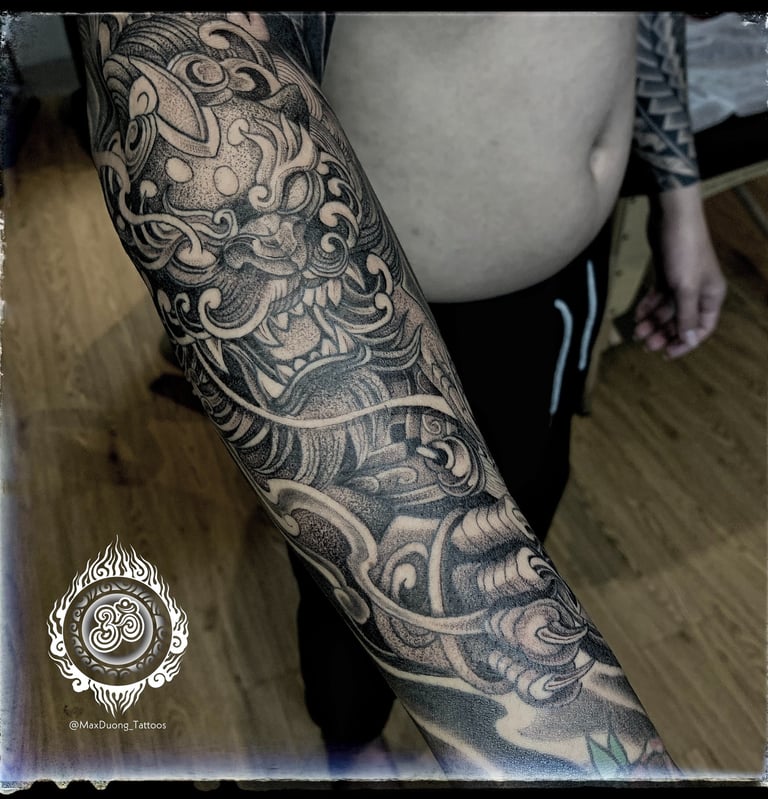 Full sleeve dotwork and Asian-style Foo Dog tattoo on the forearm