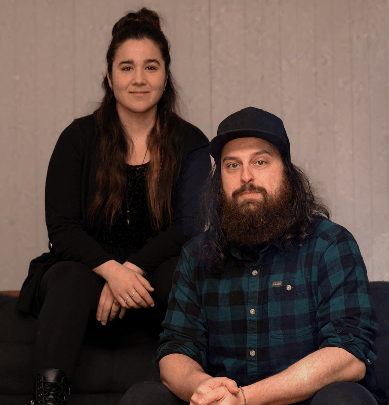 a man and woman sitting on a couch