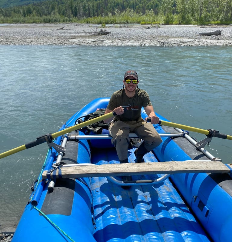 Man on Raft in Alaska on a River