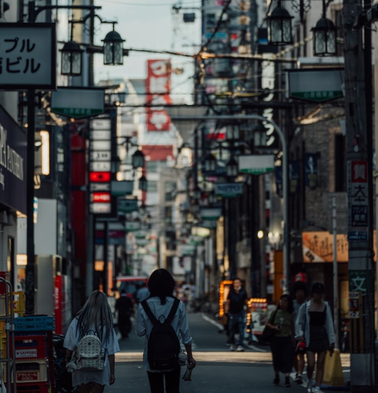 a couple of people walking down a street