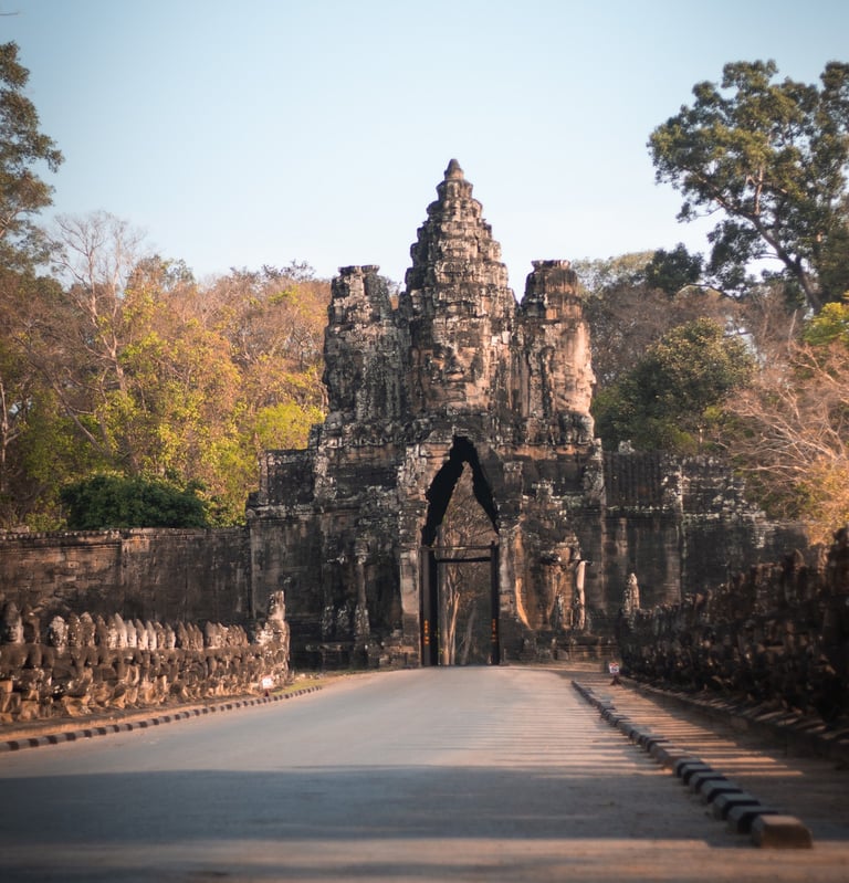 a large stone archway with a gate in the middle