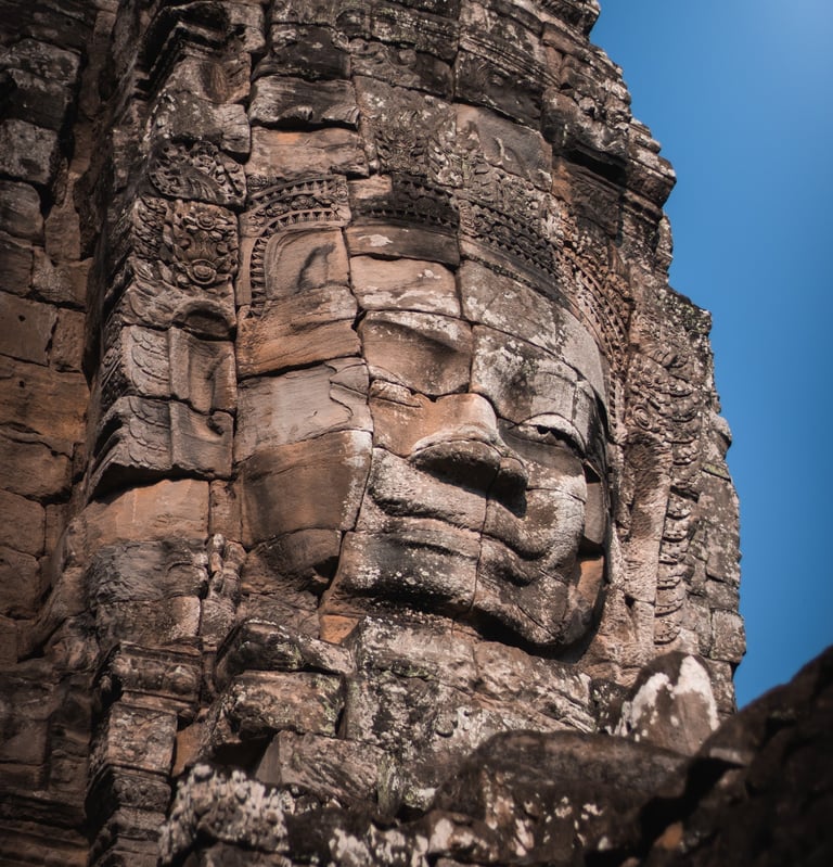 a stone face on a stone face of a face