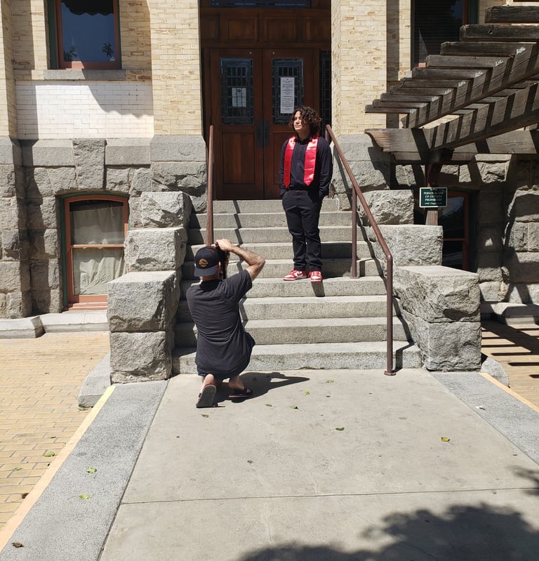 Taking a picture of a client on top of stairs