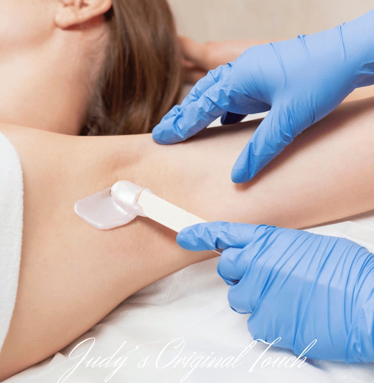 a woman is getting a tattoo on her leg