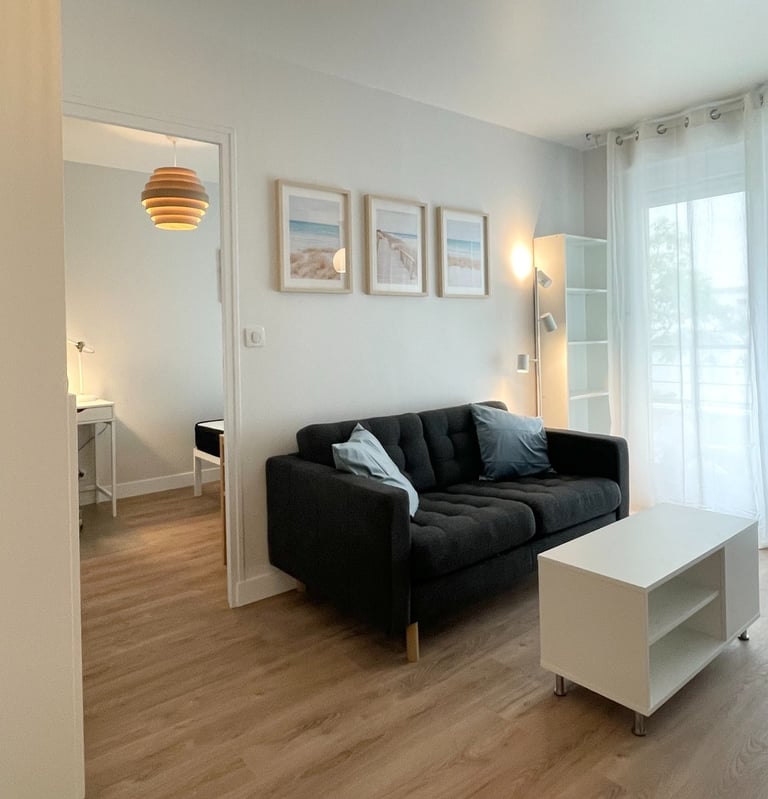 a living room with a couch and a table