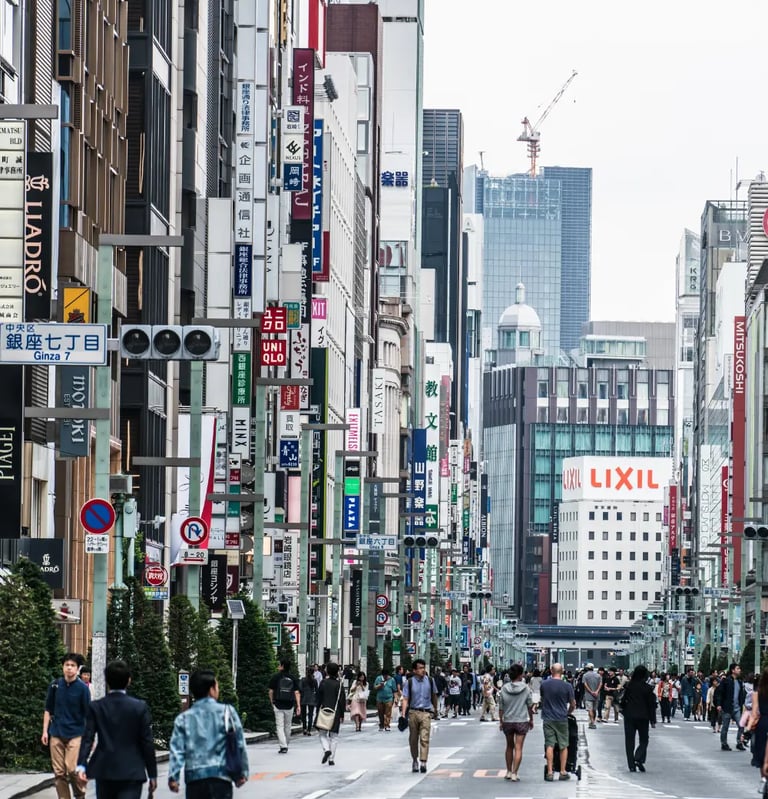 Pedestrian-friendly Chuo Dori street in Ginza Tokyo lined with designer stores, modern buildings,