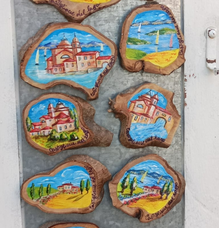 Scenes of Castigliano del Lago painted on wood