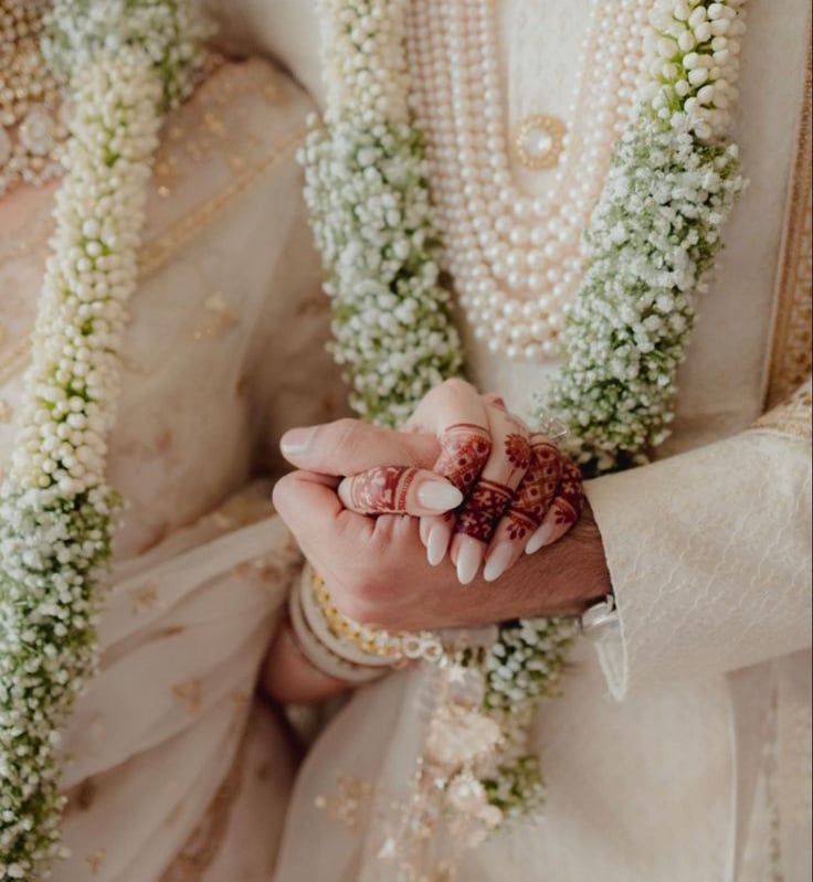 a bride and groom holding hands