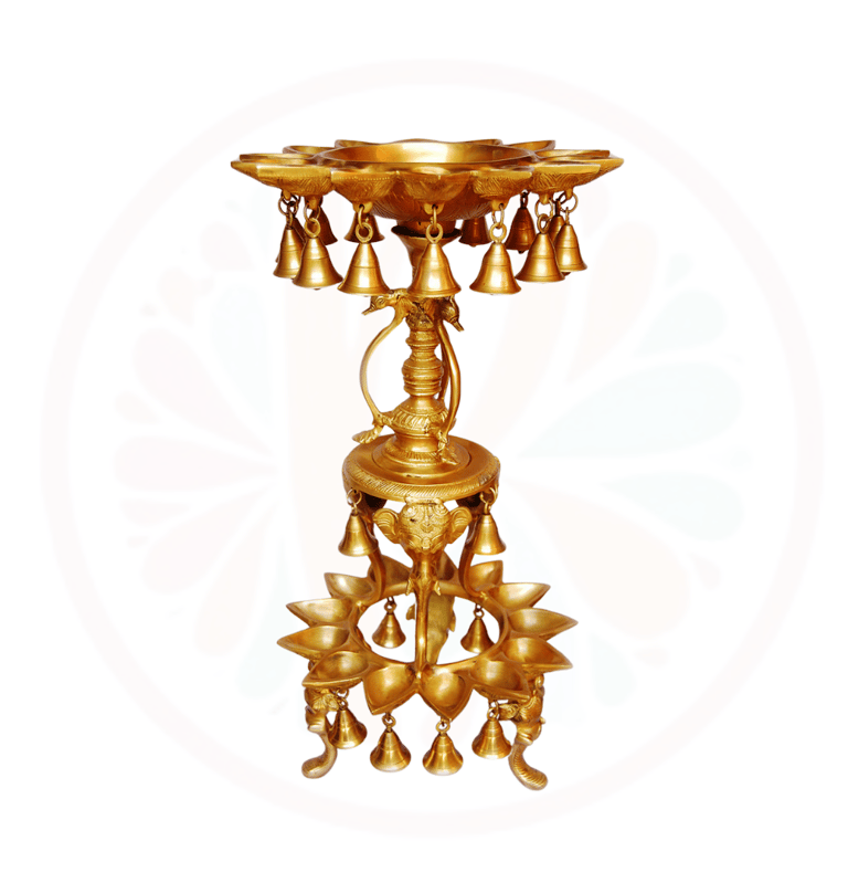 a gold candle holder with bells and bells