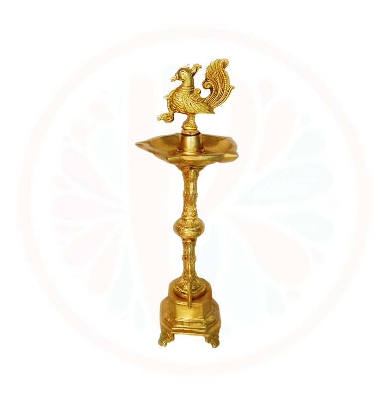a gold colored candle holder with a rooster on it