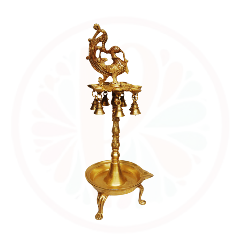 a gold colored candle holder with a bird on it