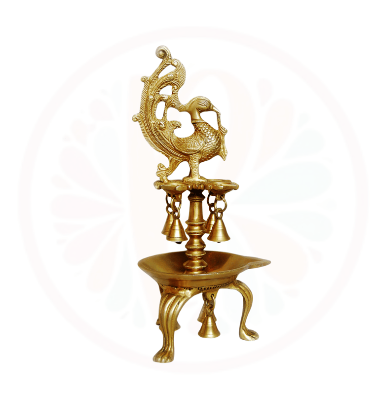 a gold colored peacock on a stand with a gold colored peacock
