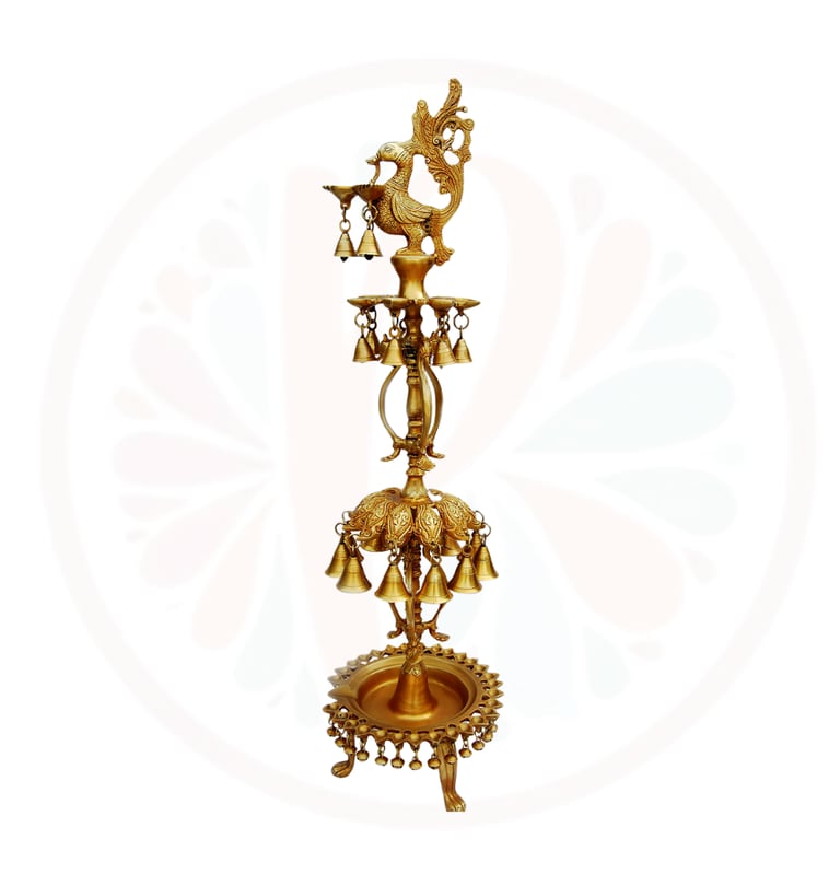 a tall brass bellows with bells and bells