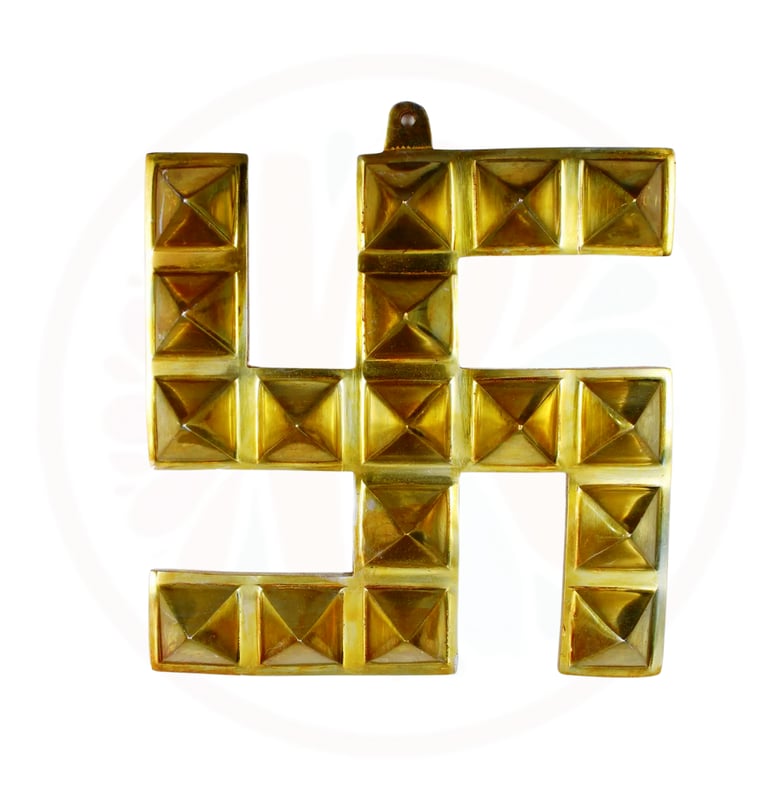a gold colored letter h with a gold colored metal studded letter h