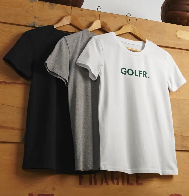 a couple of shirts that are hanging on a wall