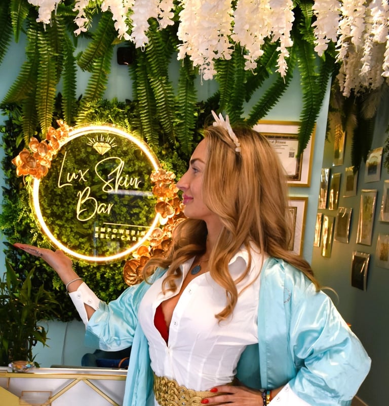 a woman in a white dress and blue dress at Lux Skin Bar