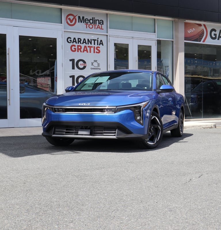 a blue car parked in front of a building