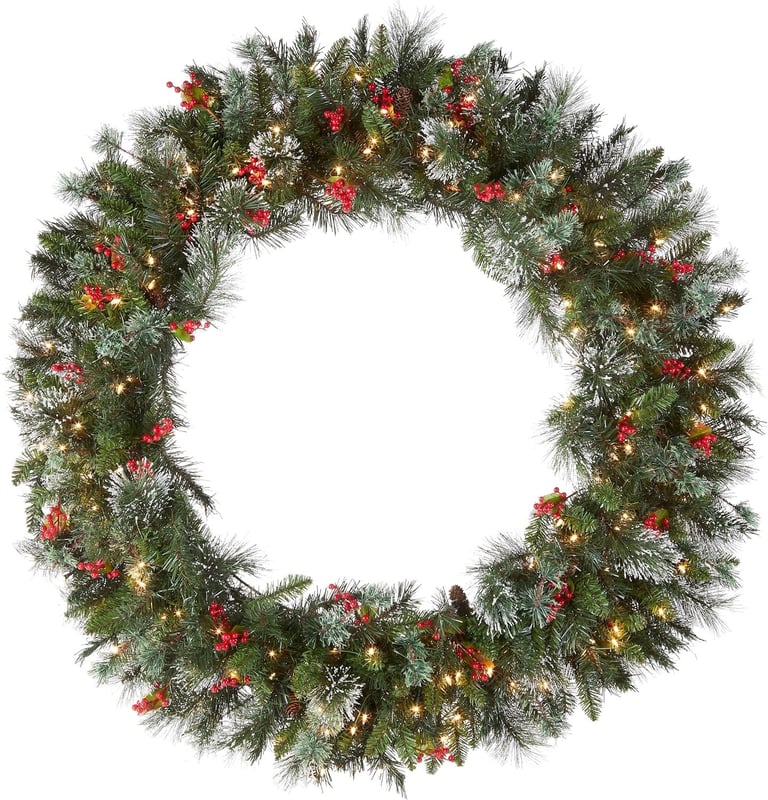 a christmas wreath with pine cones and pine cones