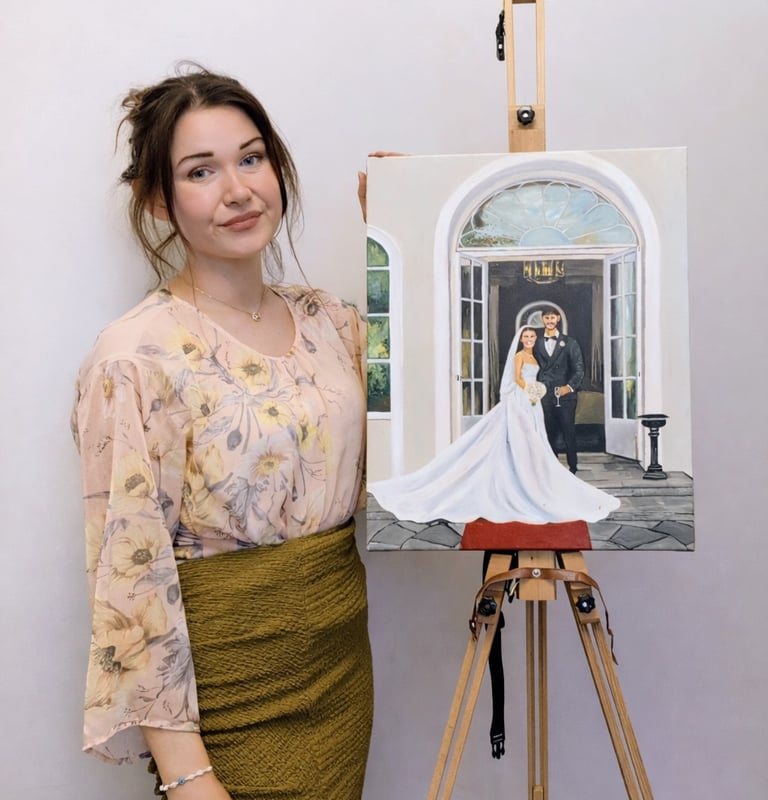Christine live wedding painter standing beside a finished wedding painting on an easel