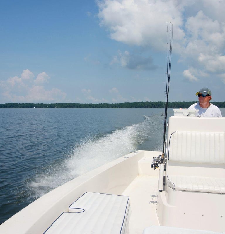 Captain Lee at the helm in Weeks Bay Alabama