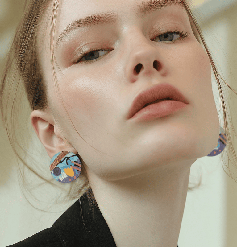 Model wearing hand painted earrings