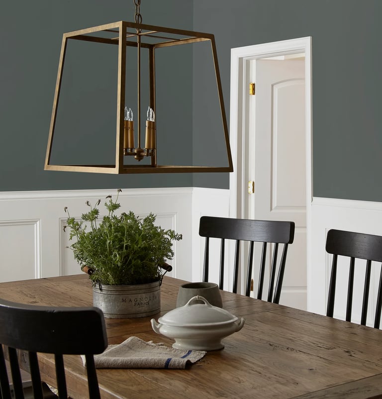farrow & ball - Cottage Grove Green dining room table with a bowl of food and a potted plant