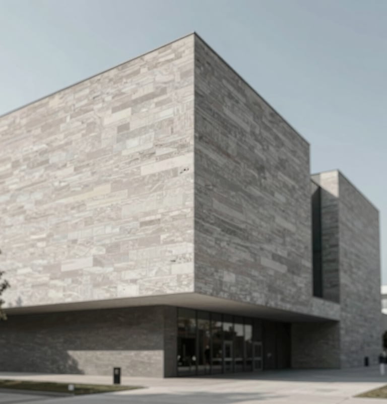 Exterior facade of a modern museum building at noon, showing textured stone surfaces and sharp shadow lines, emphasizing professional architectural photography and #D9D2C7 tones.