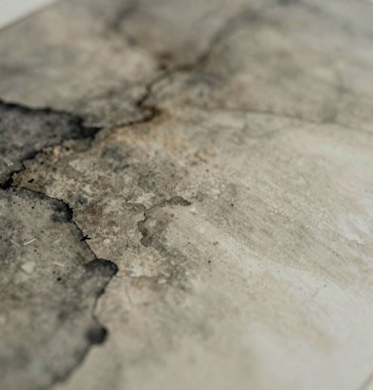 Artistic photography of abstract watercolor patterns blending grey-brown and cream, captured with a shallow depth of field, introspective and moody lighting, sophisticated aesthetic, International / Western.