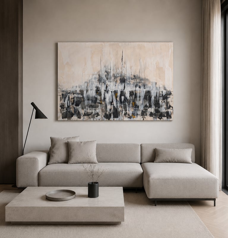 Modern minimalist living room with a beige sectional sofa and large abstract wall art.