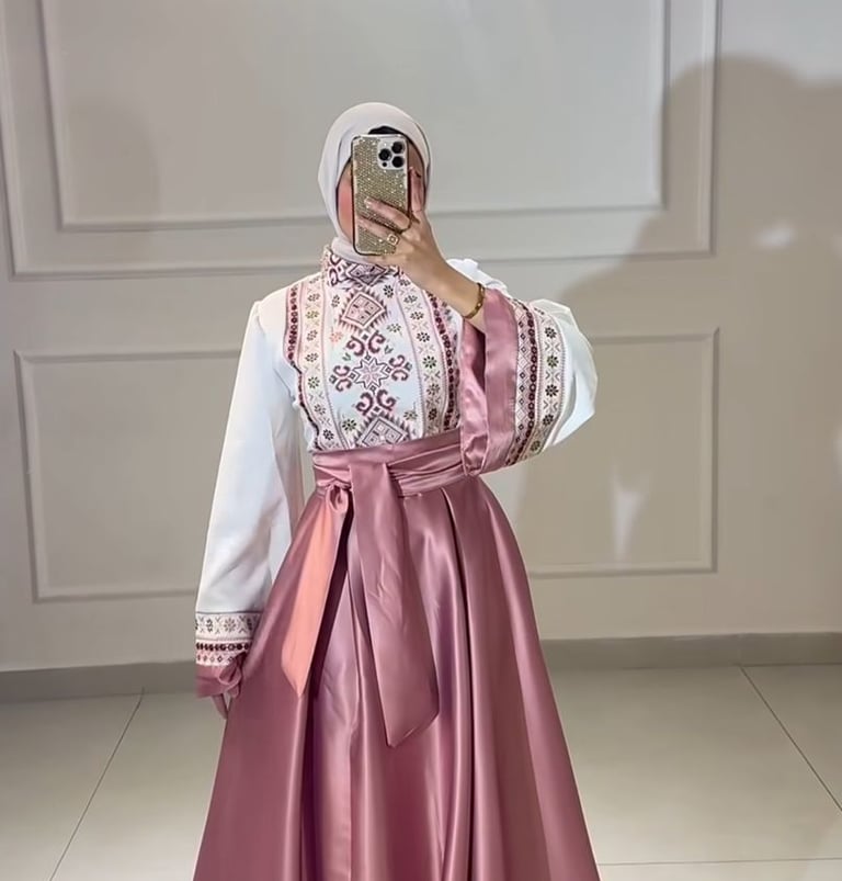 Elegant modest pink satin skirt and white embroidered long-sleeve blouse with a matching hijab.