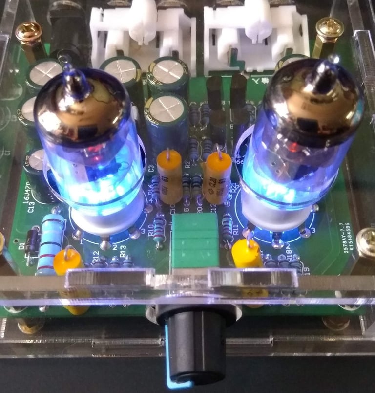 front view of valve head phones amplifier with tubes glowing blue