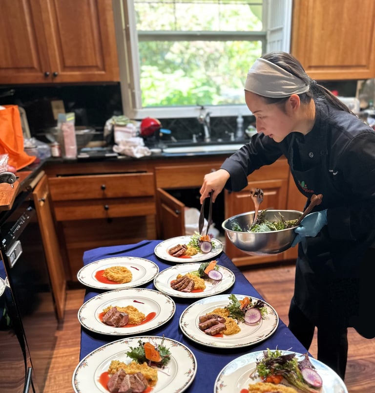 Chef mia plating seared duck, truffle infused root mash, plum gastrique for private chef dinner