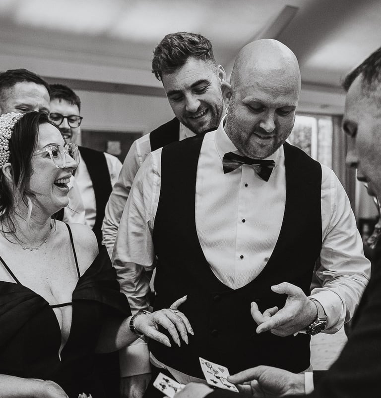 Bride and groom surrounded by friends during celebration in Leeds – wedding photography by The Weddi