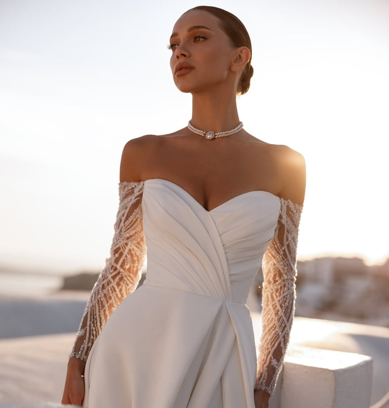 a woman in a white dress with a long sleeved dress