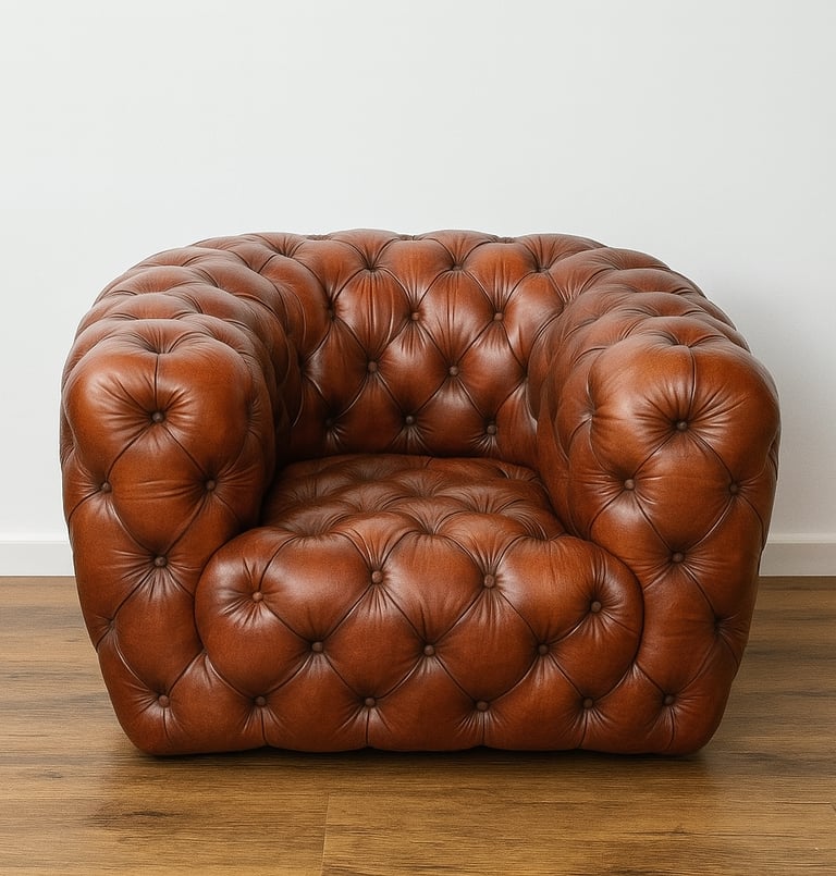 Brown leather Chesterfield armchair with button tufting