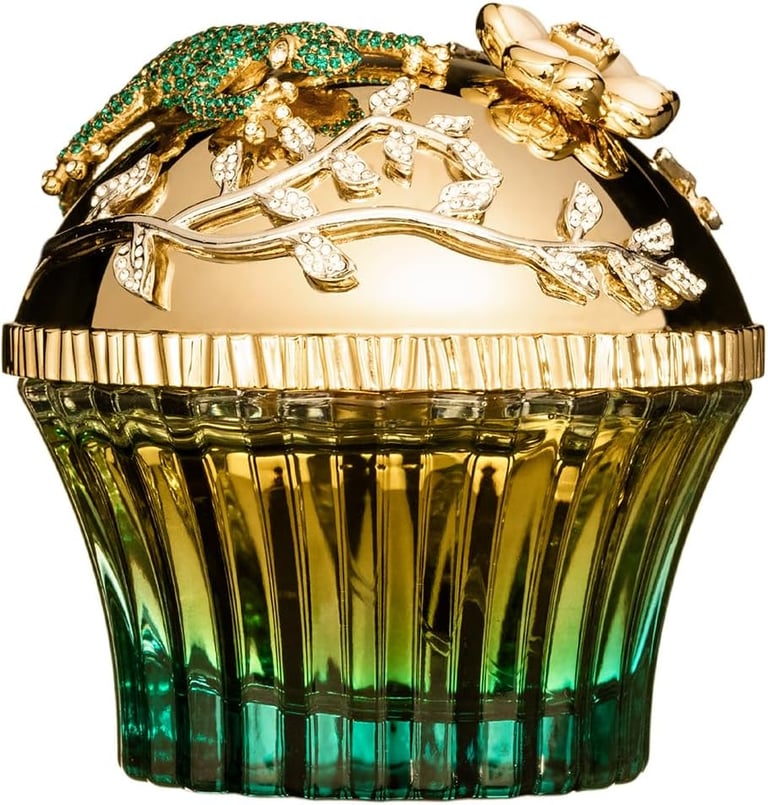 Luxury emerald cupcake perfume bottle featuring a gold lid with crystal lizard and floral accents.
