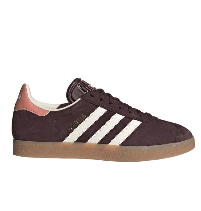 Adidas Gazelle women’s sneaker in burgundy suede with white stripes and gum sole, versatile for cozy