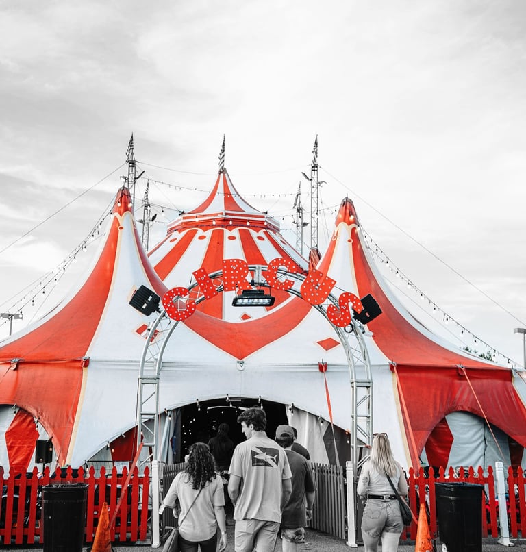 a circus tent with people walking around it