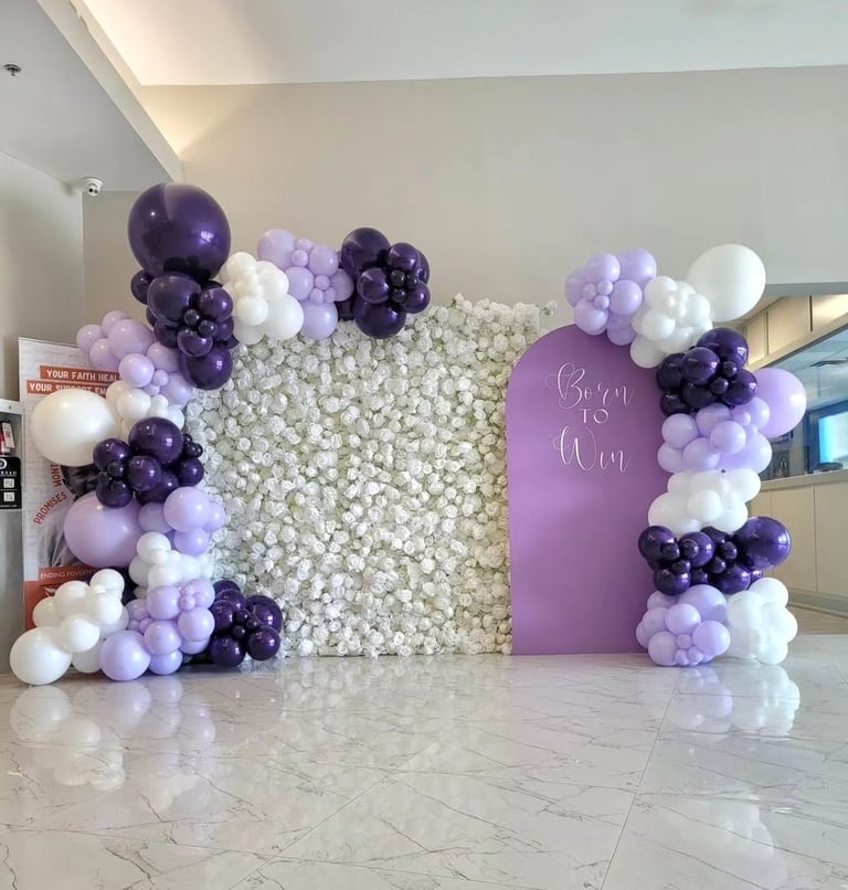 Born to win themed balloon backdrop paired with our white rose flower wall