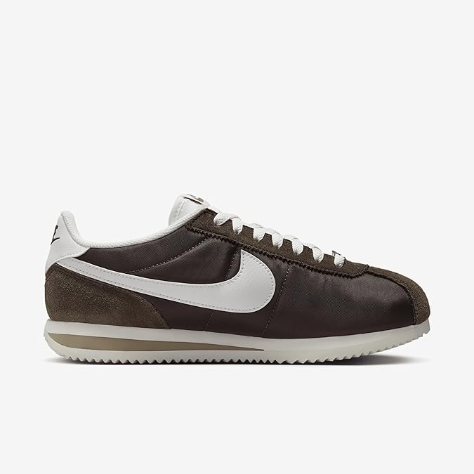 Classic Nike Cortez women’s sneaker in dark brown and white with retro running design, perfect for c