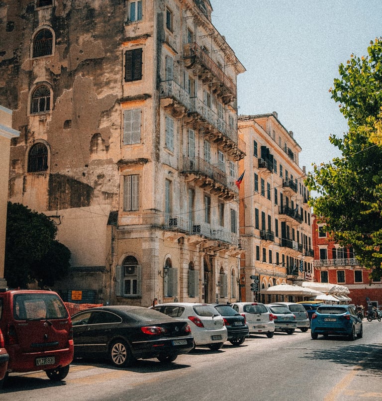 a street scene with a bus and cars parked on the side of the road