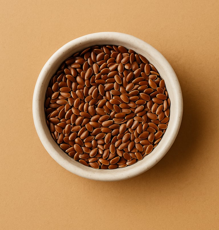 bowl of flax seeds on warm beige background, minimal natural skincare flat lay for diy flaxseed