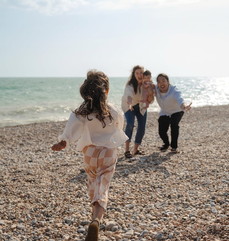 Family photography Brighton beach outdoor session parents and child natural moment