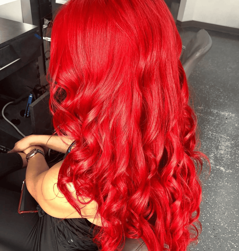 Red hair color styled in Miami by Francis Hair & More with vibrant shine