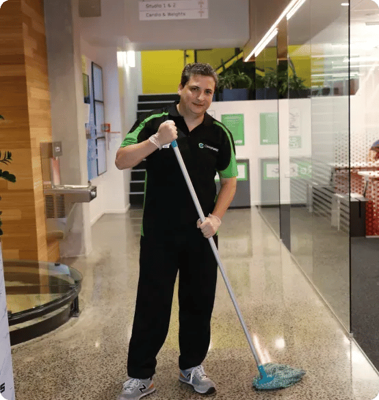 Clean Planet Wellington cleaner mopping gym floor as part of professional gym and fitness centre