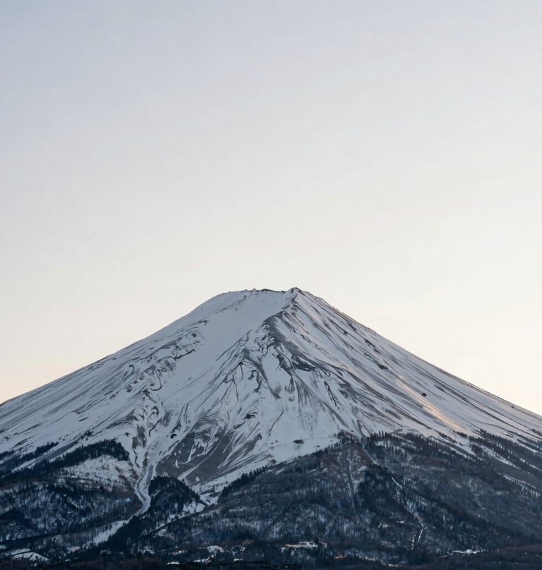Minimalist photography of a single snow-capped peak under a vast ivory sky, centered composition, soft shadows, North American winter setting.