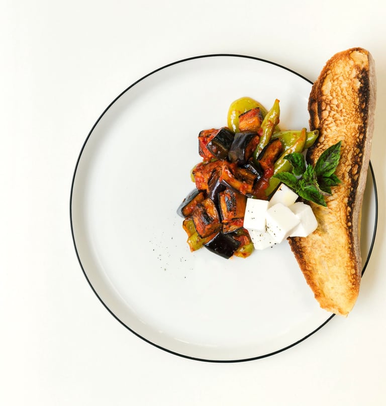Vegetables with grated tomatoes served with feta cheese and bread- a dish by Villa Eats in Naxos 